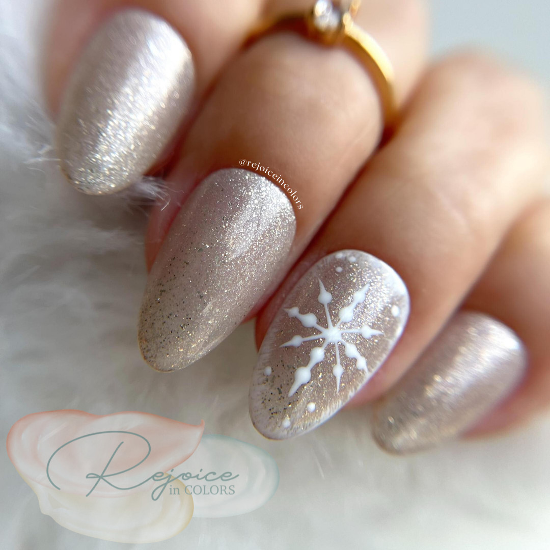 Gold Nail with one snowflake design on the hand close up