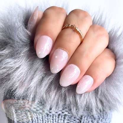 Nude base with broken flakes nail set on hand